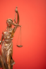 Fototapeta premium Bronze statue of the Goddess of Justice Themis, holding the Law Scales in her hands,