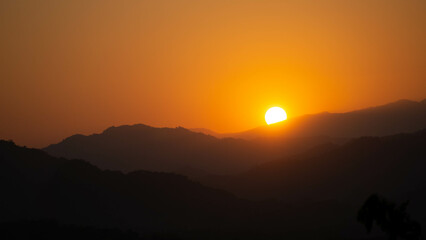Landscape of mountains during a vivid sunset in Luang Prabang, Laos