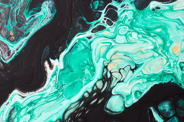 Abstract green black color background. Multicolored fluid art. Waves, splashes and blots acrylic alcohol ink, paints under water