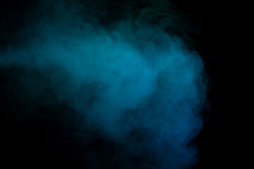 Blue and green steam on a black background.
