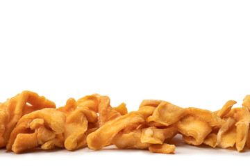 Dried melon slices isolated on a white background.