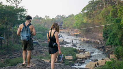 Friends walking around Tad Lo Waterfall, near Pakse, Laos