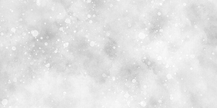 Abstract winter morning shiny white snow is falling randomly with various bokeh particles, beautiful grey watercolor background with glitter particles for wallpaper and design and presentation.
