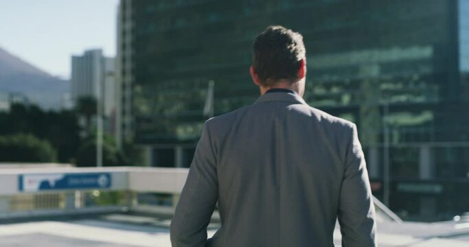 Urban, city and back of business man walking, travel or on morning journey, commute or eco friendly trip to work. Pedestrian, San Francisco and professional male lawyer on walk to law firm building