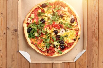 Tasty fresh pizza dish on desk