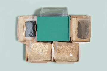 Set for growing sprouts from seeds. Seeds, linen mats, boxes and lids flat lay, top view