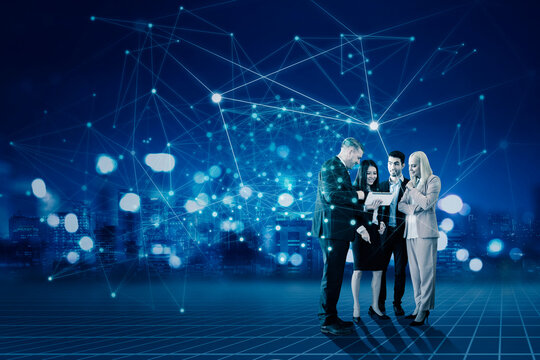 Diverse business people communicating and discussing work