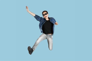 Young fun person jump on background