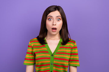 Photo of impressed astonished woman with straight hairstyle wear colorful t-shirt staring wide open eyes isolated on purple background