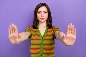 Portrait of confident woman activist wear trendy clothes showing gesture stop sexism isolated on...