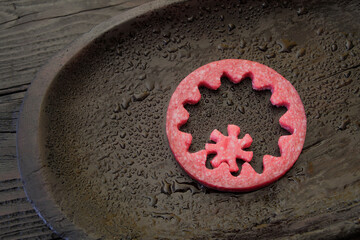 Imitation of gears carved from dry-cured sausage, cheese, bread and butter. An allegory on the...