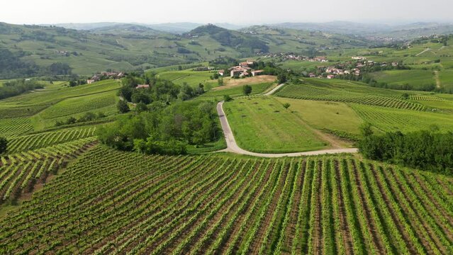Italy , Oltrepo' Pavese , 
hills with vineyards for the production of wine in Route of Wine and Flavors   - Tuscan Apennines landscape from the drone, tourist attraction destination sightseeing