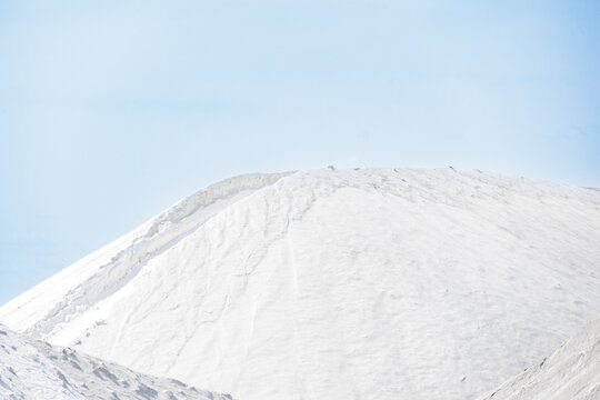 Sea salt piled up into a mountain of the salt production near the town of Aigues-Mortes in the Camarque region of France
