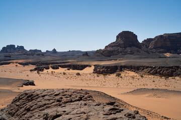 view in the Sahara desert of Tadrart rouge tassili najer in Djanet City  ,Algeria.colorful orange sand, rocky mountains