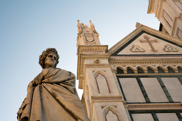 Fototapeta premium Dante Alighieri statue - Dante's hell and Basilica di santa croce - piazza di santa croce - Florence - Italy