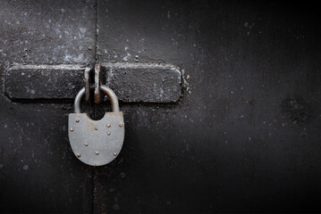 Old rusty lock on metal doors. Lock on the door with an empty place for an inscription