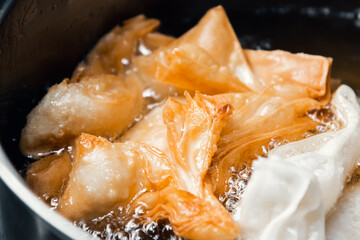 Deliciously Flaky: Step-by-Step Journey of Making Fried Flaky Pastries with Sweet Potato Filling, Fried in Lard, and Glazed with Syrup