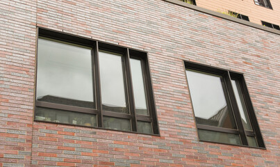 Old brick buildings symbolize timeless elegance, heritage, stability, and a sense of history in the business office environment