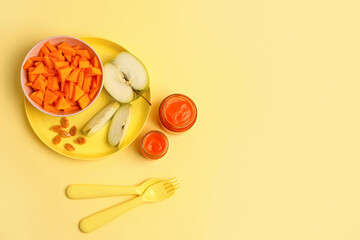 Jars of healthy baby food, fresh pumpkin and apple on color background