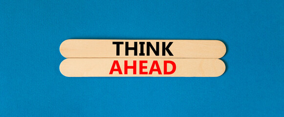 Think ahead symbol. Concept words Think ahead on beautiful wooden stick on a beautiful blue table blue background. Business, support, motivation, psychological and think ahead concept. Copy space.