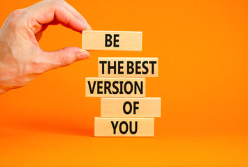 Motivational and inspirational symbol. Concept words Be the best version of you on wooden block. Beautiful orange background Businessman hand. Business motivational inspirational concept. Copy space.