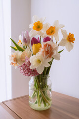 Tulips and daffodils in a jar