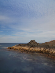 Fototapeta na wymiar Seascape with cloudy blue sky