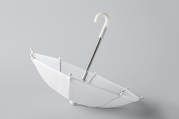 Mini umbrella on white background