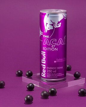 S&atilde;o Lu&iacute;s, Maranh&atilde;o, Brazil - February, 13, 2022: Red Bull a&ccedil;a&iacute; flavor edition. A&ccedil;a&iacute; berries mirrored on a purple background .