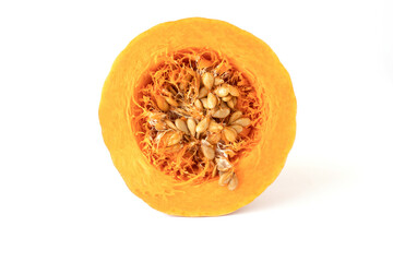 Close-up of a cross-section of an orange pumpkin with seeds on a white background.