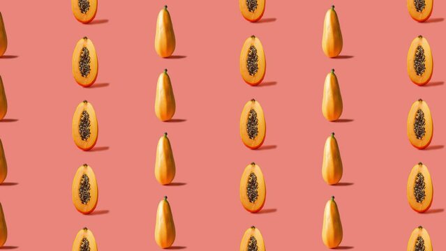 Stop motion Cut and whole Papaya appear and disappear on pastel background. High quality video 4K. Detailed stop motion video. Background or wallpaper in food and drinks videos.