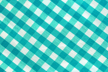 The texture of linen fabric in a large cell of green and white. Scottish tailoring material