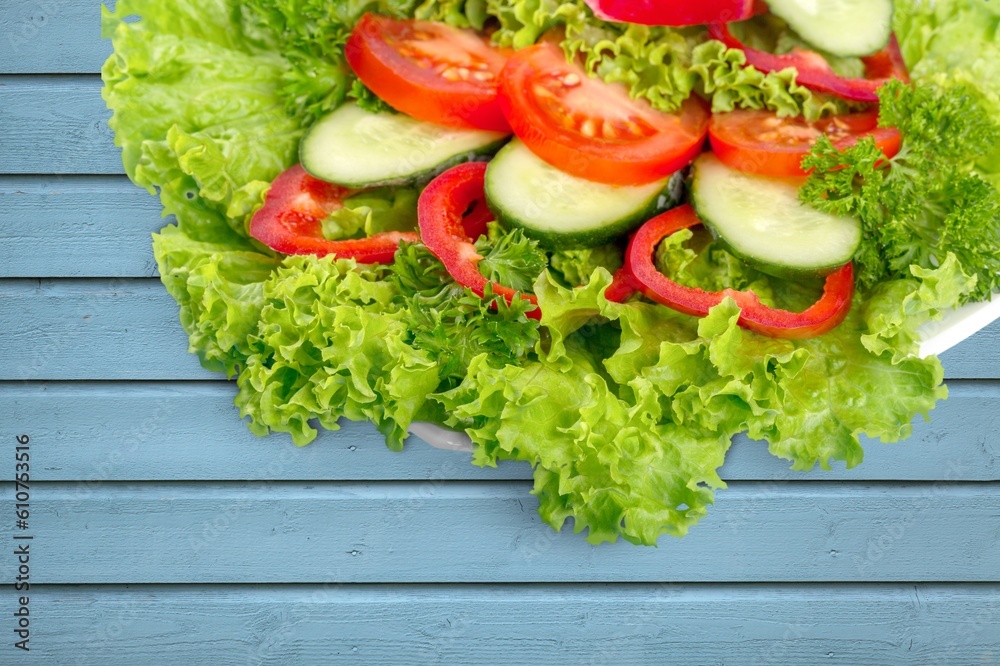 Wall mural Tasty fresh vegetable salad dish