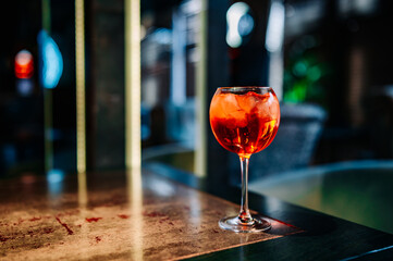 alcoholic cocktail in a glass stands on a table in a bar or restaurant