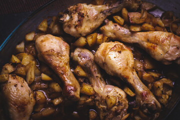 Delicious oven-roasted chicken thighs with golden brown potatoes, comforting main course.