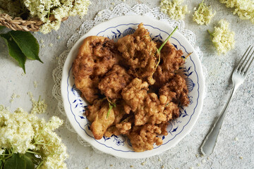 European elder blossoms fried in batter in spring
