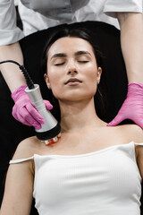 Tightening and rejuvenation of girl skin at cosmetology procedure. Thermal or radio frequency...