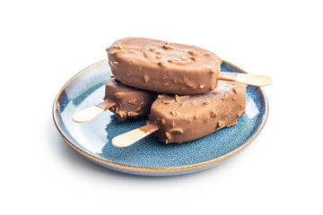 Popsicle, ice cream covered with chocolate on plate isolated on white background.