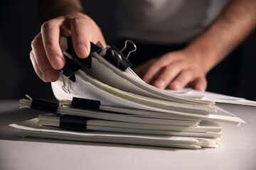 Businessman writing paper in file , hard work to do