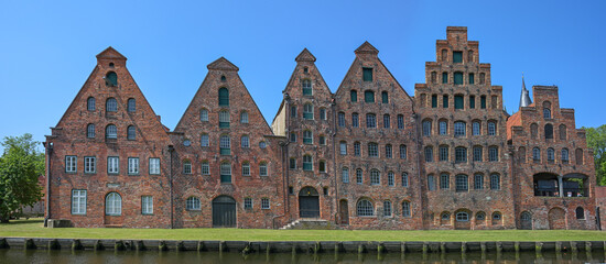 Salzspeicher of Lubeck, historic salt storage houses in red brick architecture against a blue sky,...