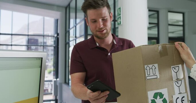 Delivery, office and delivery man with cardboard box for parcel return, issue or problem. Ecommerce, import and male courier employee with package shipment by the receptionist desk in cargo workplace
