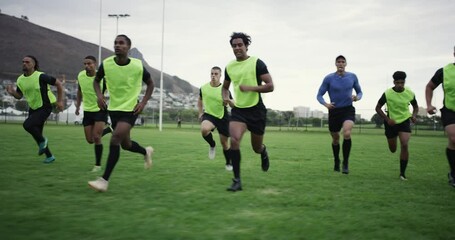 Rugby, training and coach with men running for exercise and warm up for practice, match or game. Fitness, teamwork and trainer with players workout for wellness, performance or cardio on sports field