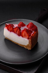 Delicious fresh cheesecake with strawberries, syrup and mascarpone cheese