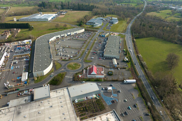 Aerial view of goods warehouses and logistics center in industrial city zone from above