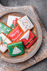 Fototapeta na wymiar Beautiful colored Christmas gingerbread cookies for the design and decoration
