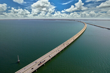 Sunshine Skyway Bridge over Tampa Bay in Florida with moving traffic. Concept of transportation...