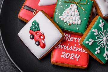 Beautiful colored Christmas gingerbread cookies for the design and decoration