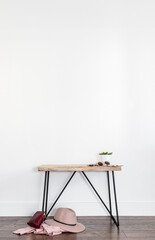 Interior mockup with empty table and clean white wall