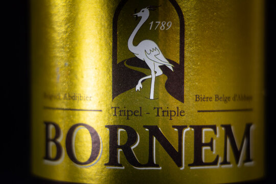 LIEGE, BELGIUM - MARCH 21, 2021: Selective blur on a macro shot of the label of a bottle of a Bornem beer, a tripel triple beer. Bornem is a belgian beer produced by Van Steenberge brewery in Flanders