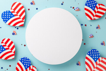 Obraz premium Happy Fourth of July! Top view of patriotic decorations, hearts with the American flag design, glittery confetti on a pastel blue backdrop with an empty circle for messages or advertisements